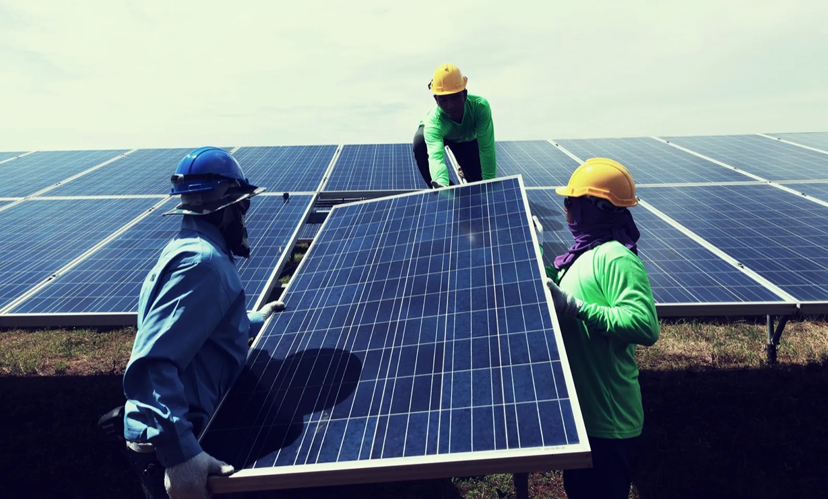 Installers handling a Tier-1 solar panel